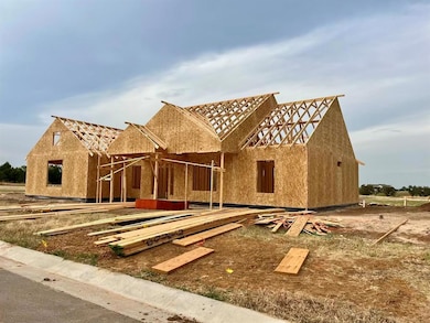 Unfinished property featuring stucco siding