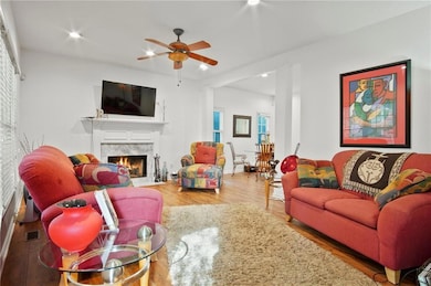 Living area featuring wood finished floors, a high