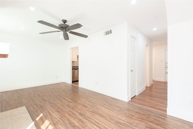 Spare room with light wood finished floors, recessed lighting, and a ceiling fan