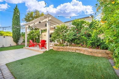 View of yard with a pergola and a patio area