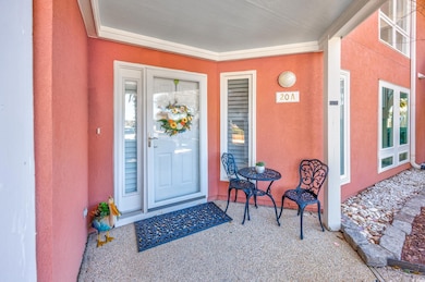 Entrance to property with stucco siding