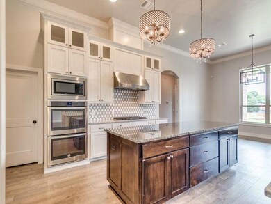 Kitchen – photo is of a similarly finished builder