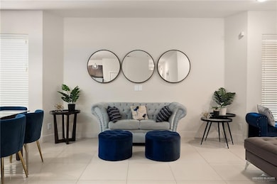 Sitting room featuring light tile patterned flooring