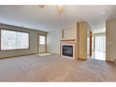 Main floor living room with gas fireplace.