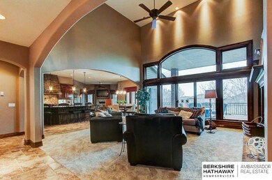 10209 S 164 St.  Open to Gourmet Kitchen with 16 ft. ceiling.  Looking out on covered deck.
