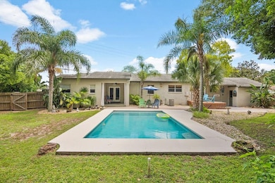 Backyard Tropically Landscaped with Gorgeous Pool.