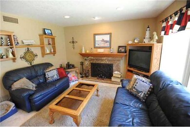 The famil;y room has a cozy fireplace