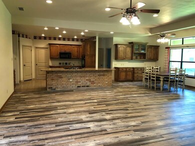 Open Living, Living, Dining.  Dining room has Buil