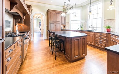 Big kitchen with gas range, large windows and plenty of counter space.