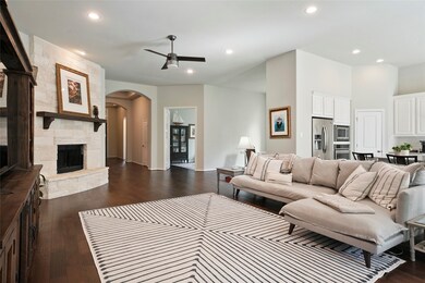 You're going to love the attention to detail throughout. Notice the arched doorways and tray ceilings in the entry, French doors leading to the study, stone fireplace in the family room, raised ceilings, and beautiful wood floors.
