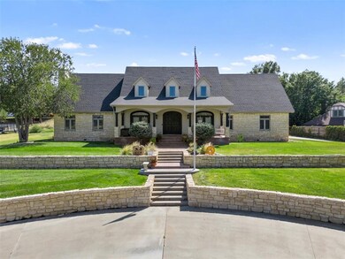 Cape cod home featuring a front lawn