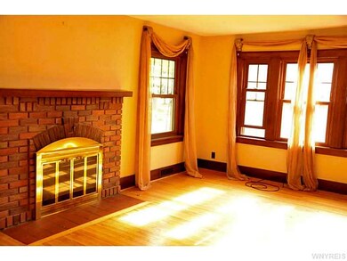 Living Room. Updated windows and cozy fireplace.