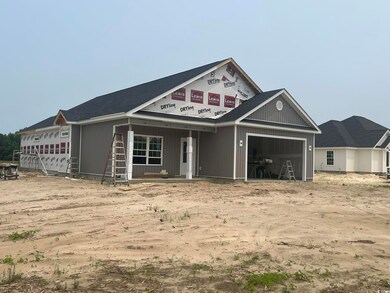 Property under construction with an attached garage
