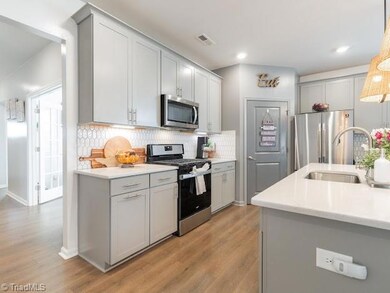 Upgraded cabinets and tile backsplash