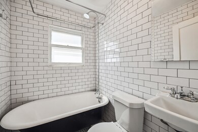 Recently renovated bathroom with an antique ball &