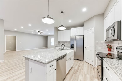 The open layout connects seamlessly to the living area, making this kitchen the heart of the home.
