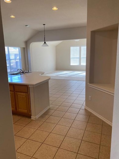 Kitchen with light tile patterned flooring, vault