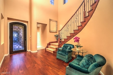Entryway featuring wood finished floors, baseboard