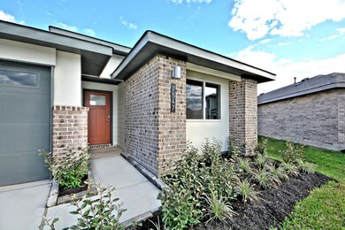 Covered Front Porch Entry with Upgraded Coach Ligh