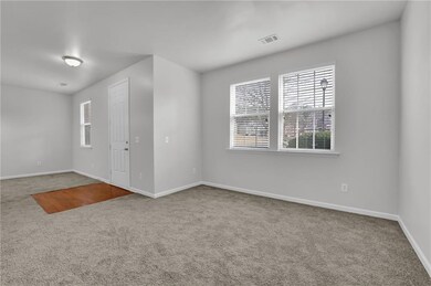 Empty room featuring carpet flooring