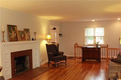 The living/dining room boasts of a gas log firepla