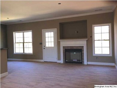 Great room with gas log fireplace and huge tv box 