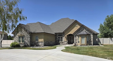 French country style house featuring stone siding and stucco siding