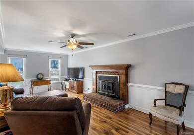 Brick fireplace is the focal point of the spacious