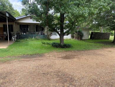 View of yard with covered porch
