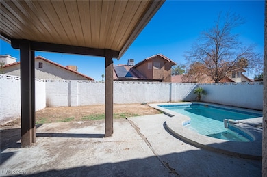 View of pool featuring a fenced backyard and a patio area