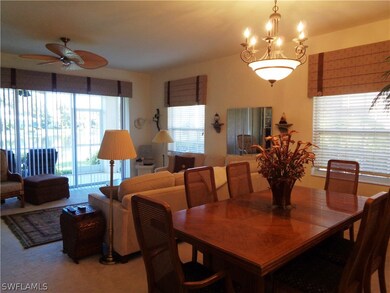 Carpeted dining area featuring ceiling fan with no