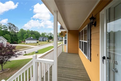 Deck featuring covered porch and a residential vie