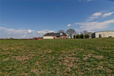 Another view of back of home from further back on the property....5 acres cleared & 5 acres wooded