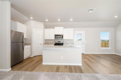Open-concept kitchen and dining area with sleek fi