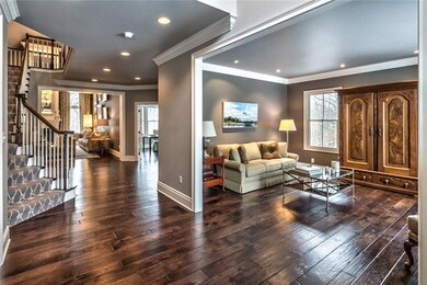 The spacious living room with view to back of home.