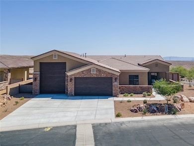 Ranch-style home with stucco siding, a 2-car with