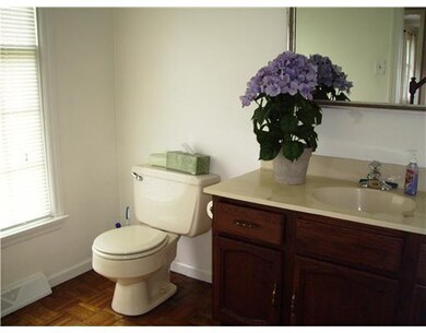 Partial Bath. Powder room off foyer has parquet fl