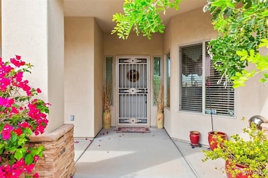 Entrance to property featuring stucco siding