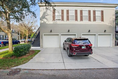 back of unit -showing 2 car garage and entrance to