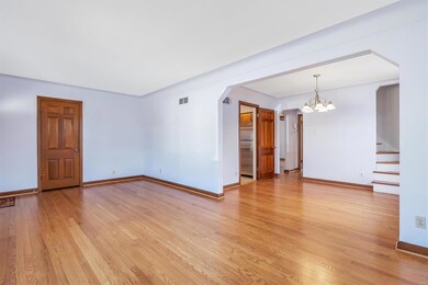 Period arch connects Living to Dining room