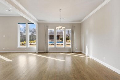 Unfurnished room with a chandelier, light hardwood