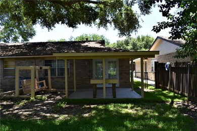 Rear Yard has Covered Patio Built in Table remains