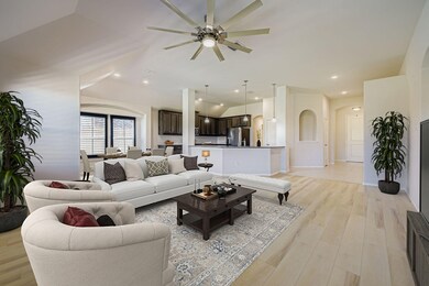 Living room with light wood-style floors, recessed lighting, lofted ceiling, and ceiling fan