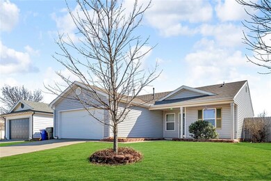 Ranch-style house featuring a garage, a shingled r