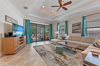 Great Room with crown molding, porcelain tiled flo
