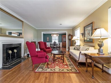 Spacious living room with newly refinished hardwoo
