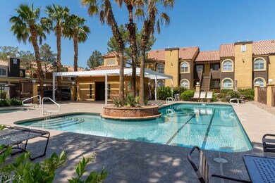 Community pool with a patio area