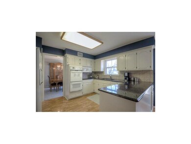 Double ovens and glass cook top.