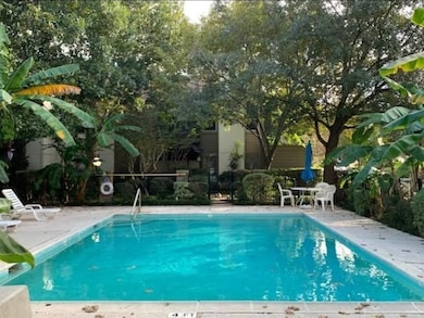 This photo showcases a serene backyard with a well