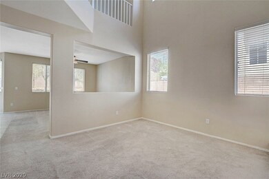 Formal living room with view into family room